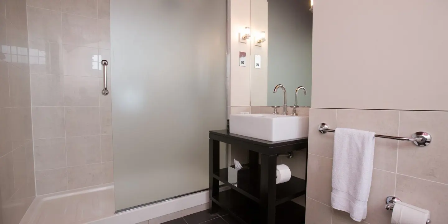 Bathroom featuring a sink and shower.