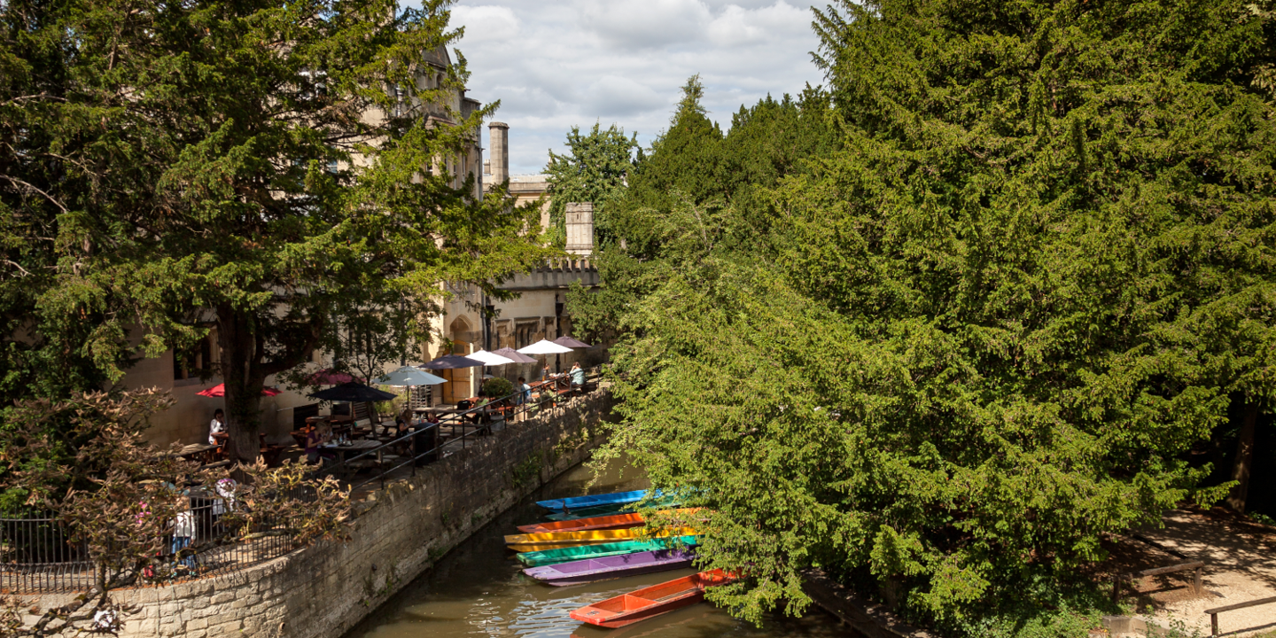 Vibrant assortment of boats sailing along a picturesque river.