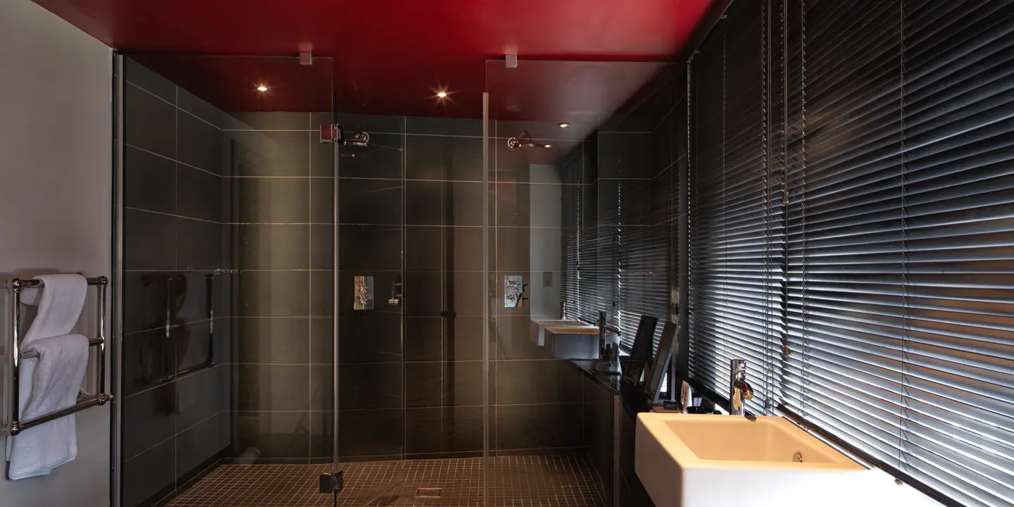 Bathroom with large dual walk in shower and dual sinks. 