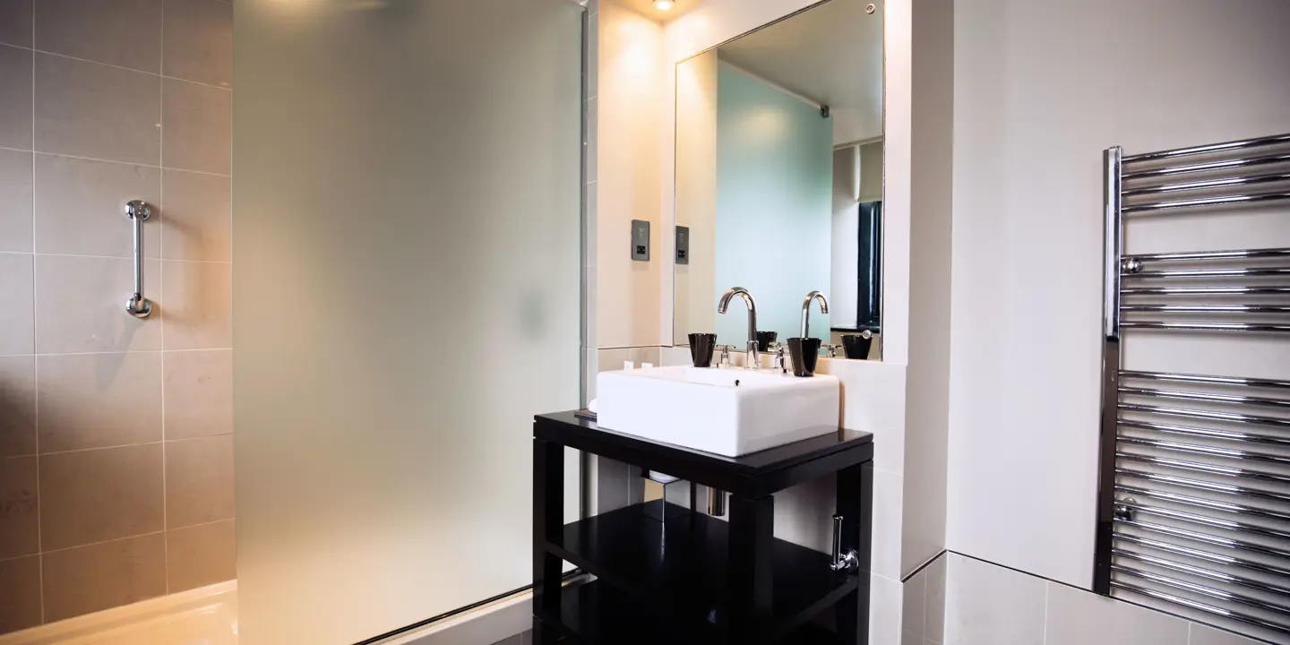 Bathroom featuring a sink and shower.