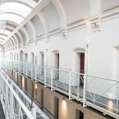 A long hallway with many windows.