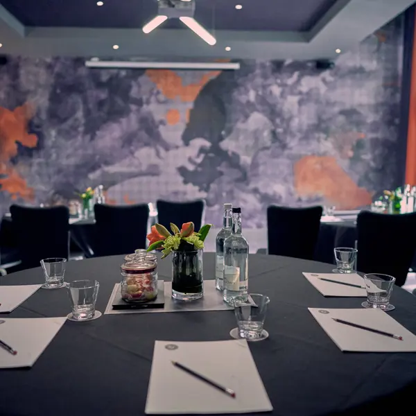 A table arranged with neatly set place settings.