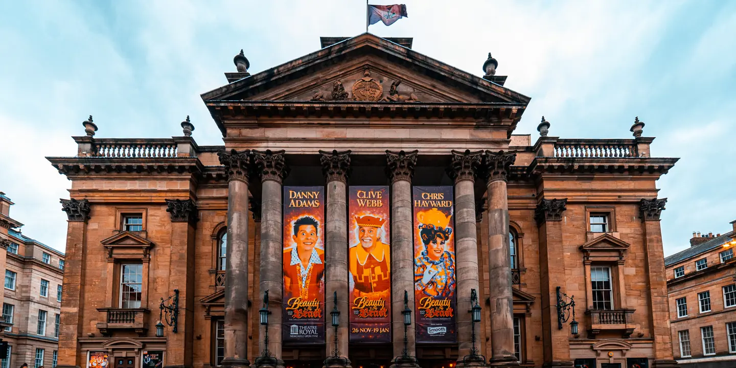 A prominent building adorned with numerous banners.