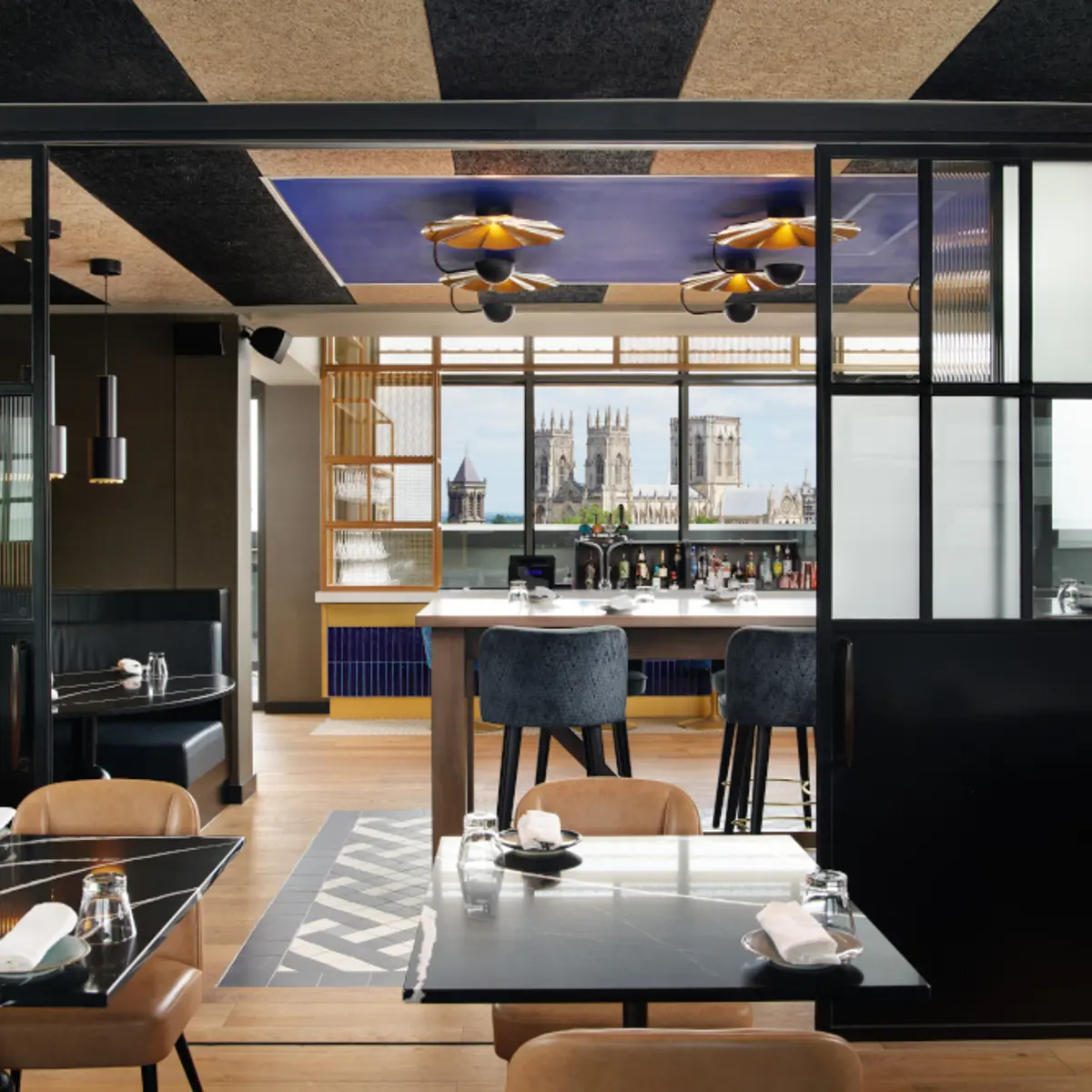 A dining room featuring tables and chairs.