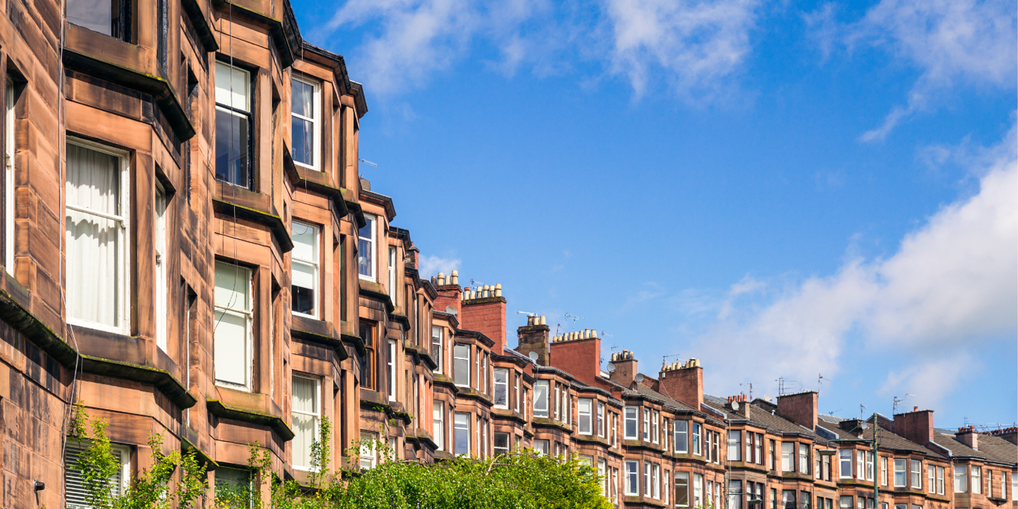 Brick buildings lining a city street.