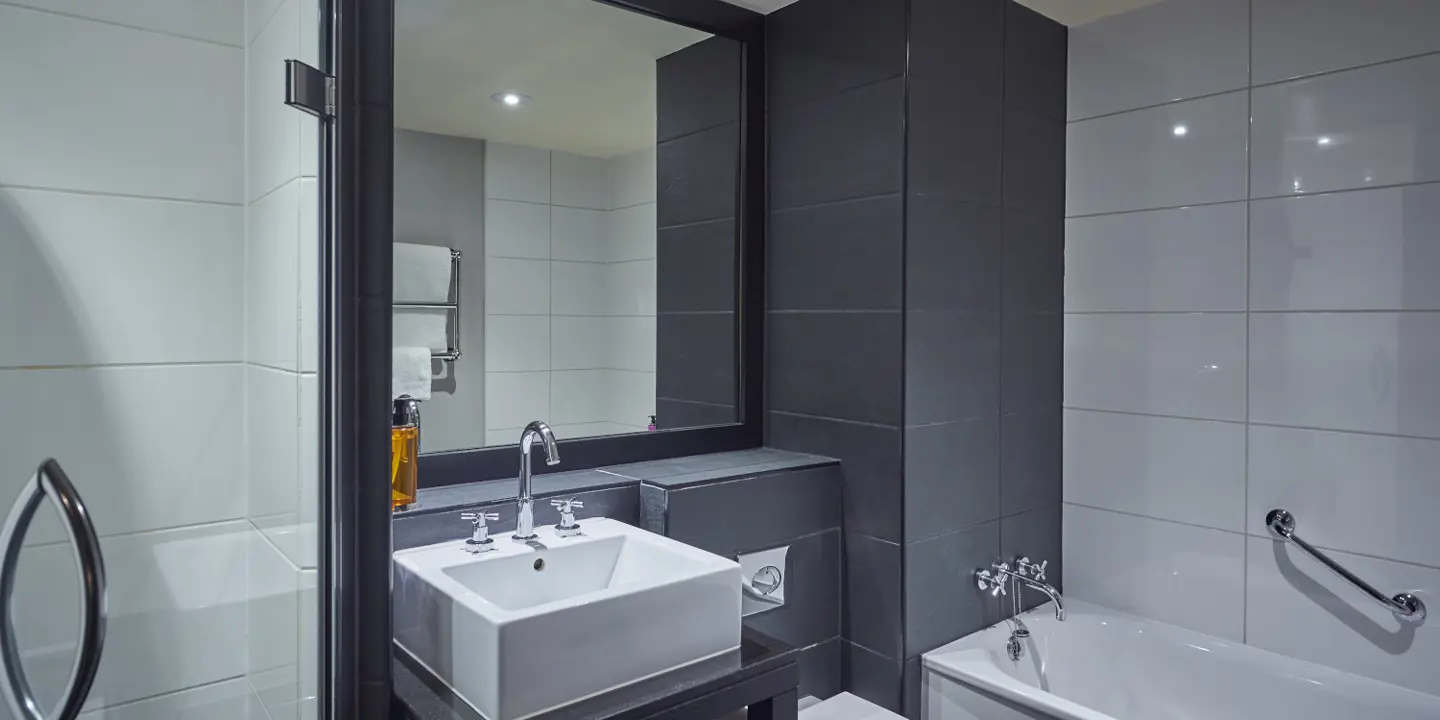 A bathroom featuring a sink, toilet, and bathtub.