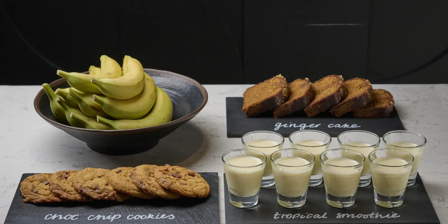Table with four dessert-filled glasses.