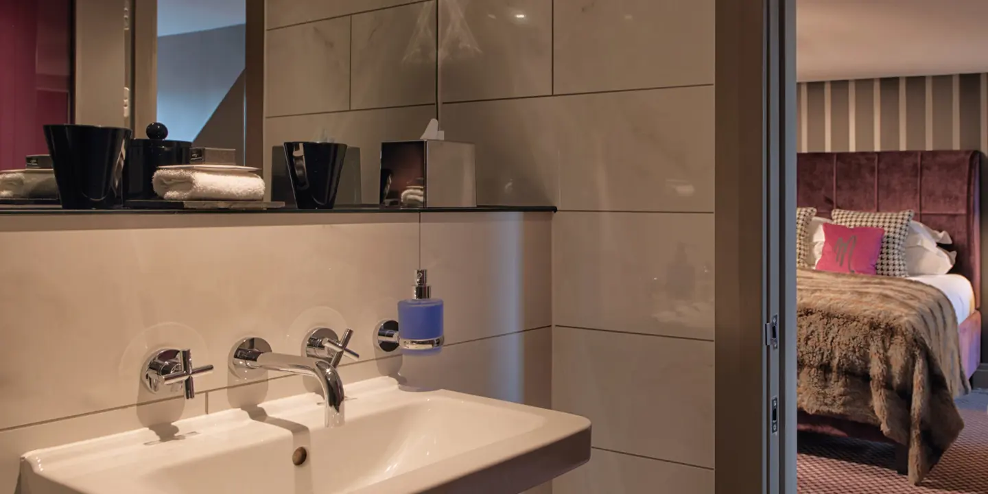 Bathroom featuring a sink and mirror.