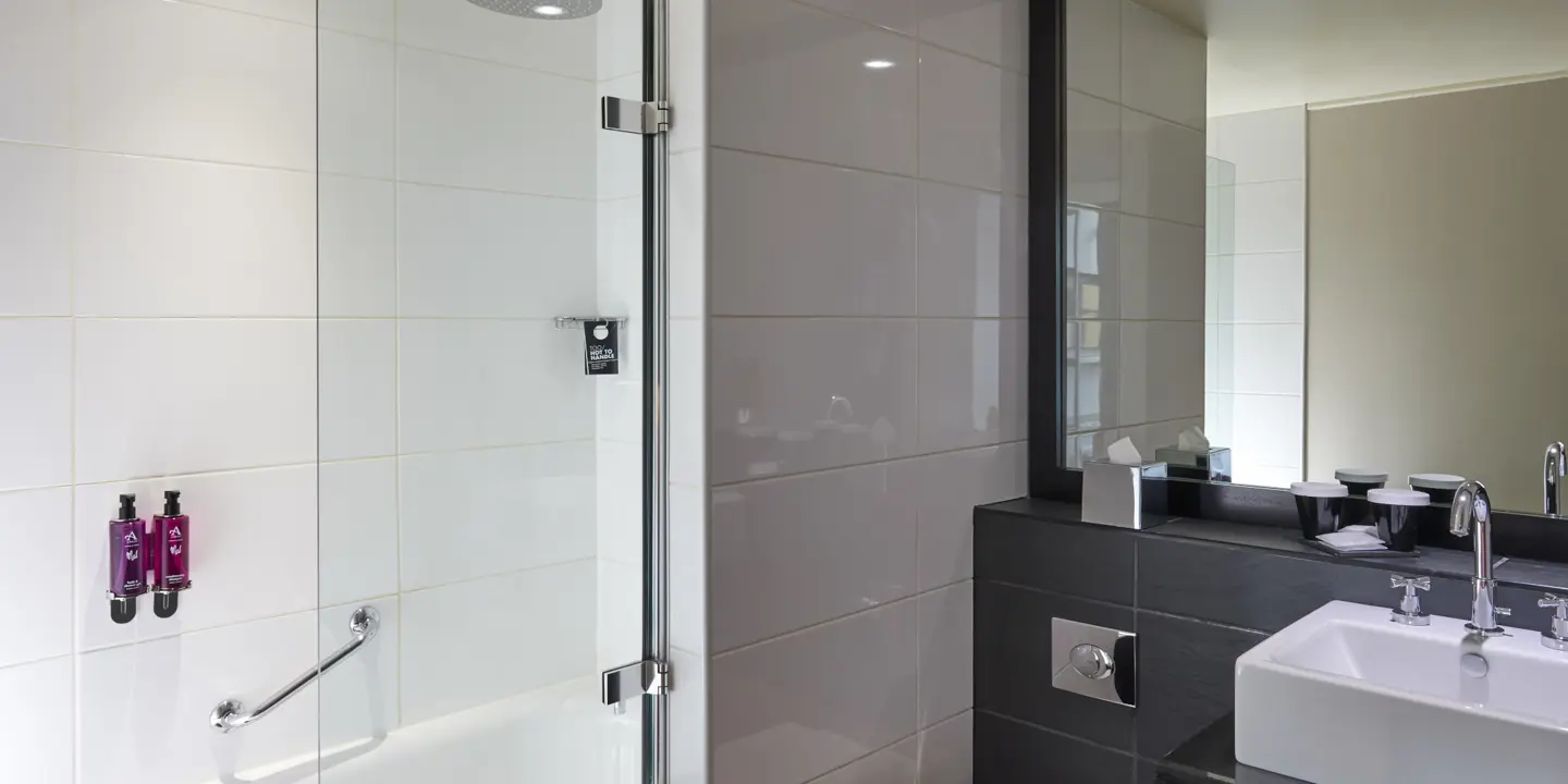 A bathroom featuring a sink, toilet, and shower.