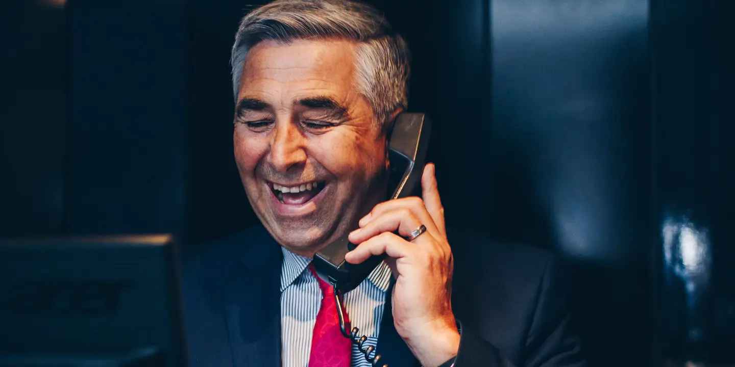 Receptionist smiling on the telephone