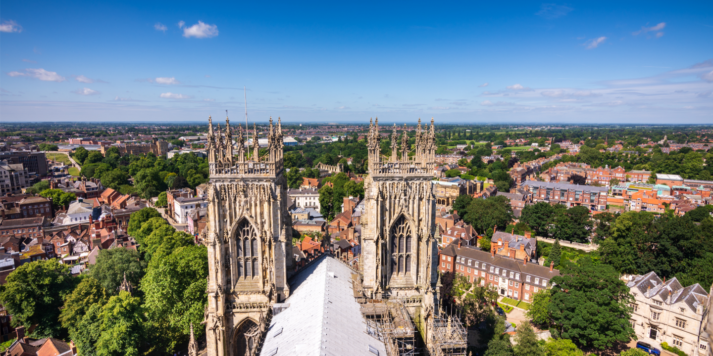 Aerial view of a city featuring a cathedral