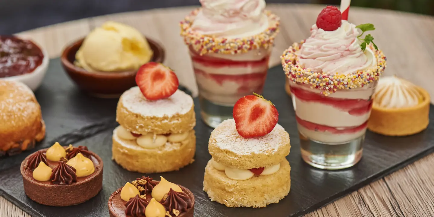 Assortment of pastries and desserts displayed on a table.