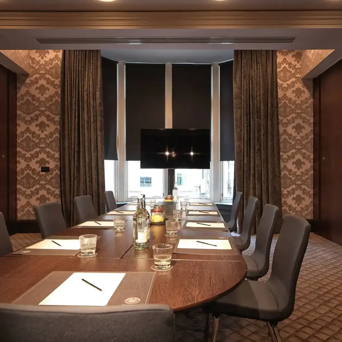 Conference room featuring a spacious table and chairs.