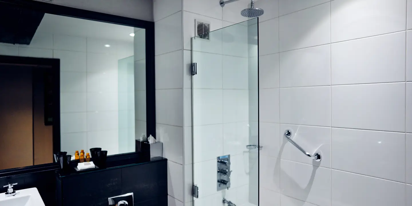 Bathroom with bathtub, sink and mirror.