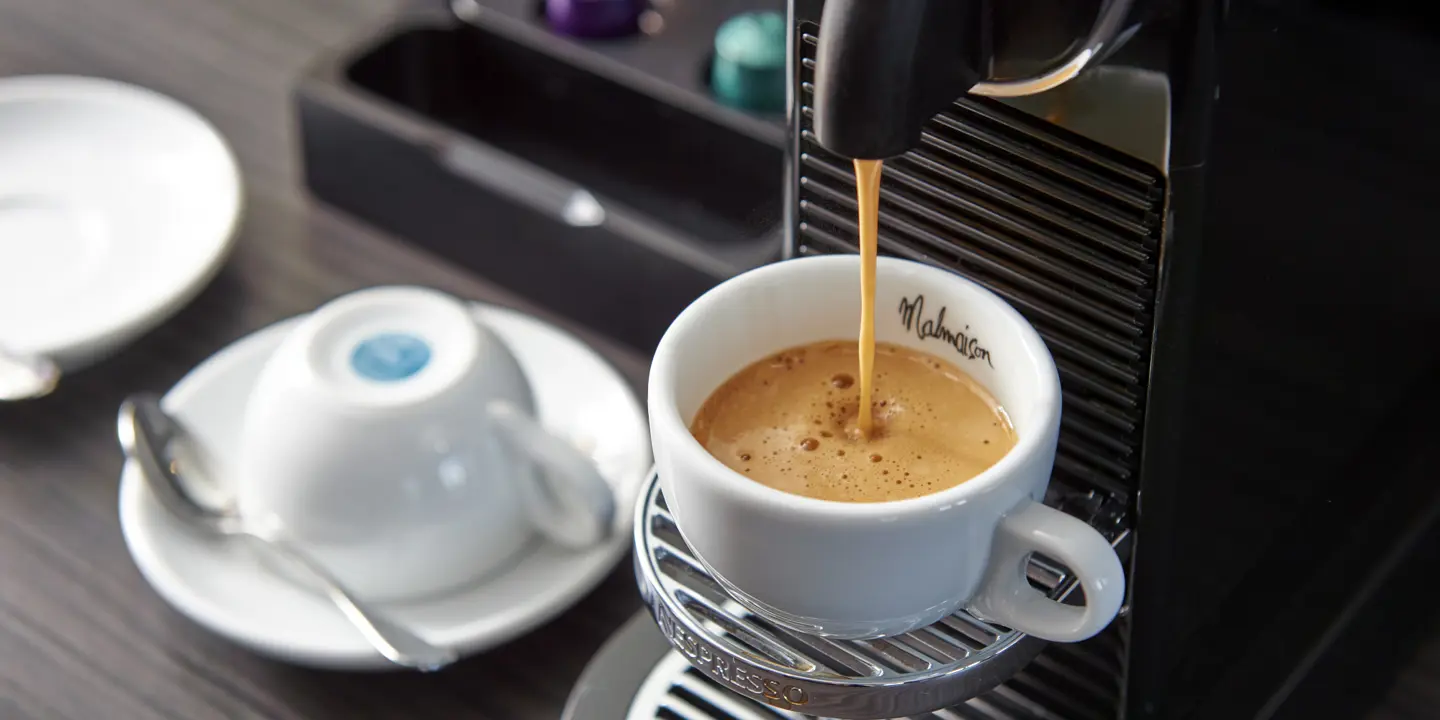 A cup filled with freshly brewed coffee.