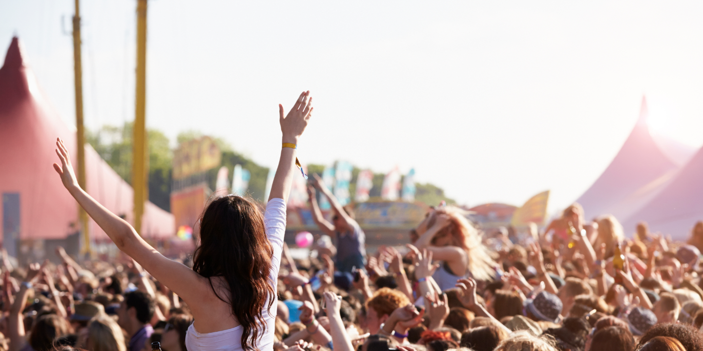 A gathering of numerous individuals at a music festival.