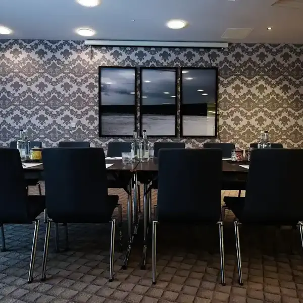 Conference room featuring a long table and chairs