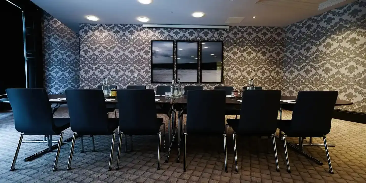 Conference room featuring a long table and chairs