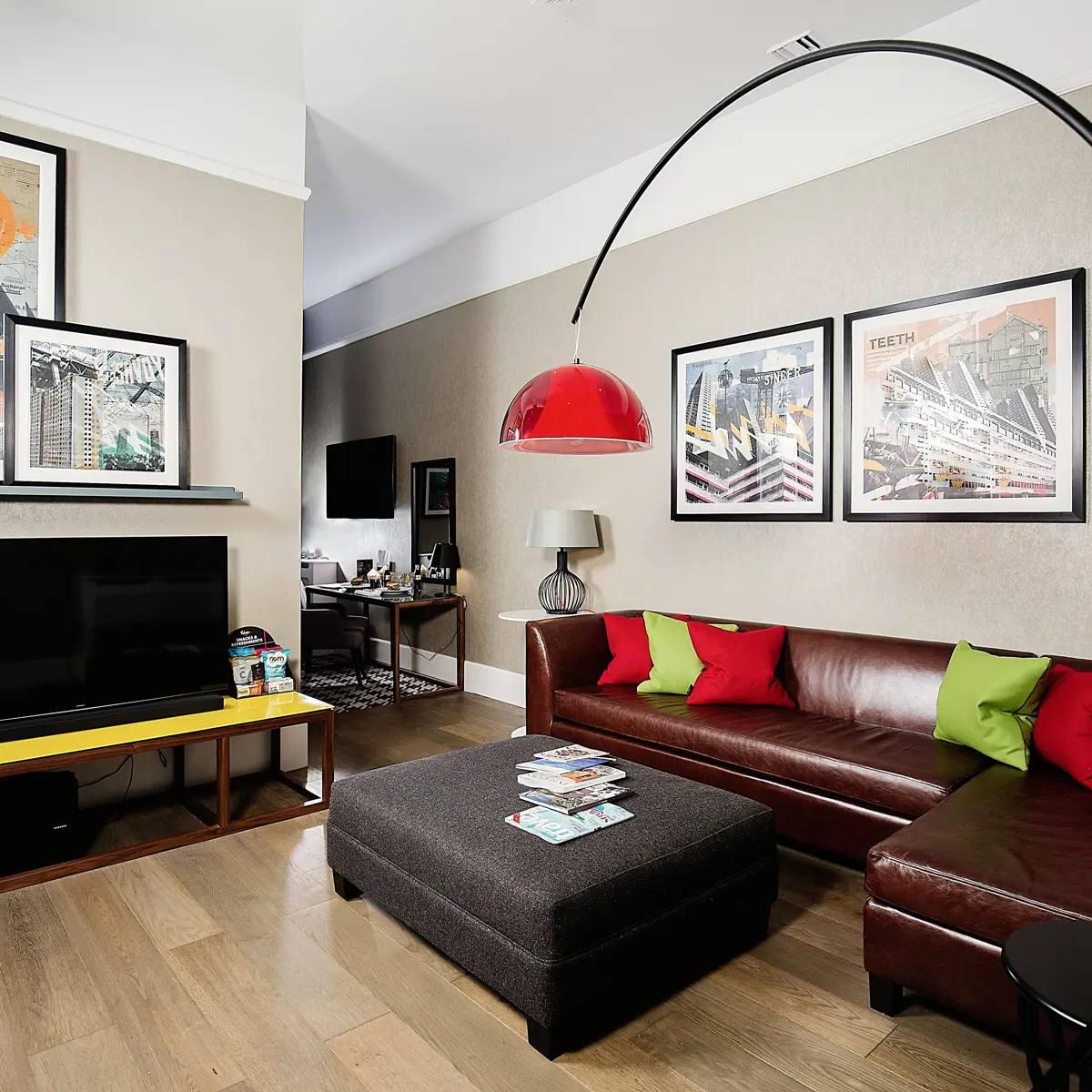 A well-furnished living room featuring a flat-screen TV.