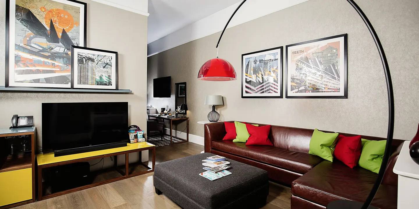 A well-furnished living room featuring a flat-screen TV.