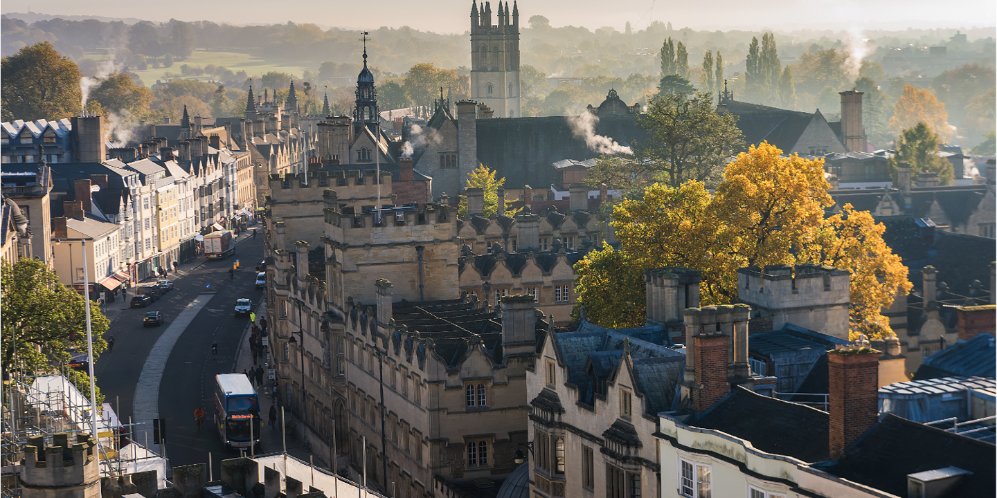 Aerial view of a city featuring a clock tower.