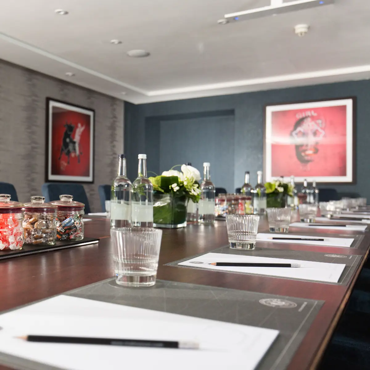 Meeting room table with bottles of water and drinking glasses