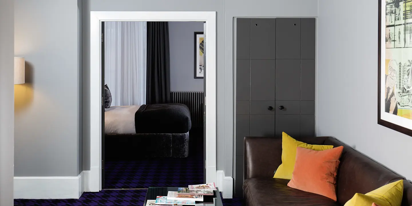 A well-furnished living room with an elegant purple carpet.