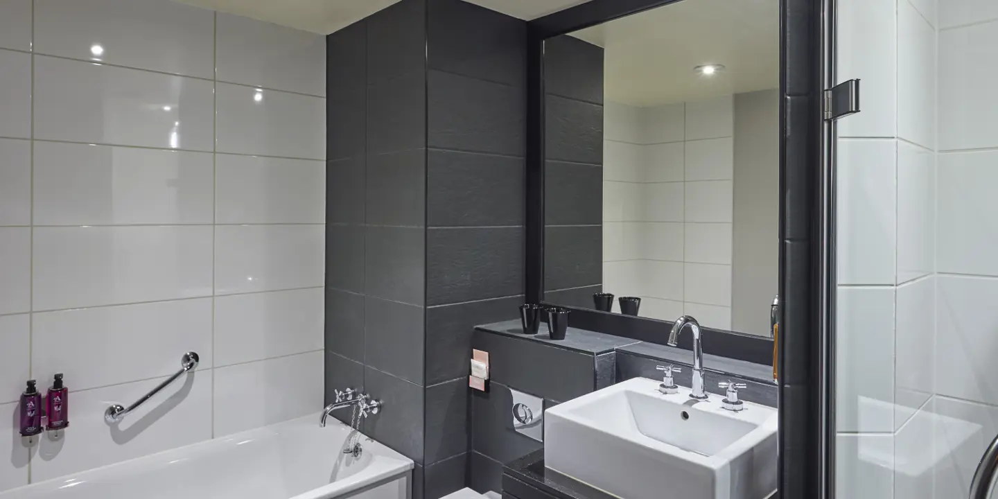 A bathroom featuring a sink, toilet, and bathtub.