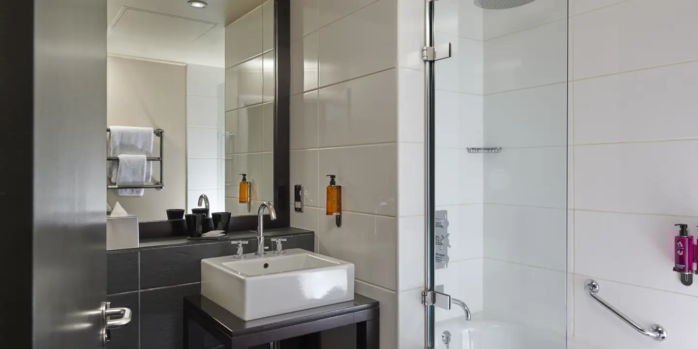 Bathroom featuring a sink and shower.