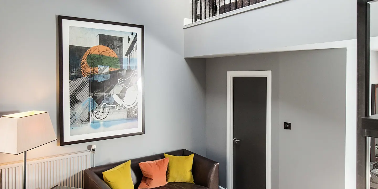 A well-furnished living room with a balcony.