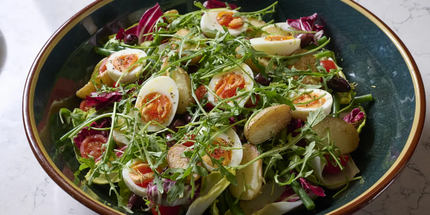 Tray with a plate of food, including French fries.
