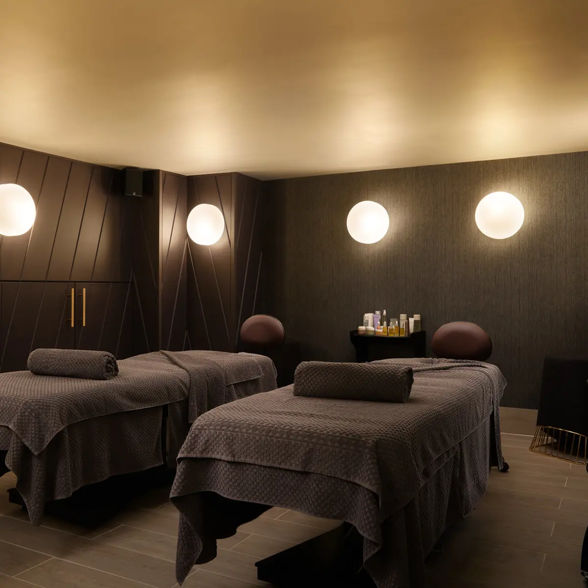 Two massage beds in a serene room.