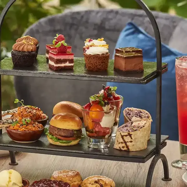 Table adorned with an assortment of mini dishes and cocktails