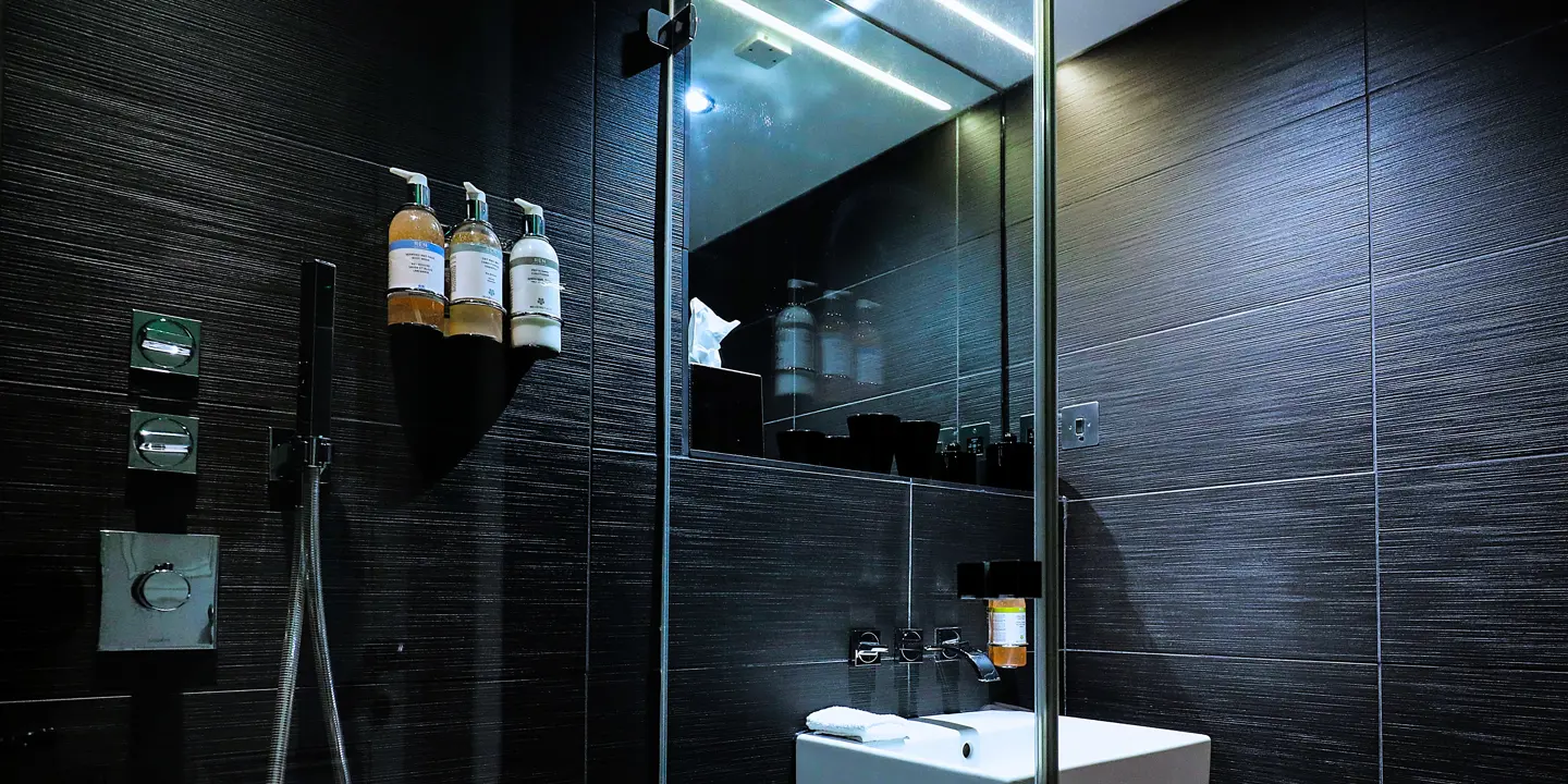 A bathroom featuring a sink and shower.