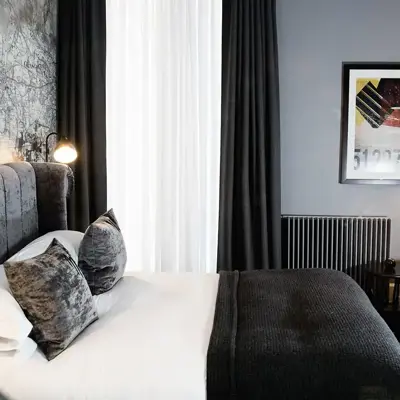 View of a bedroom through a round window.