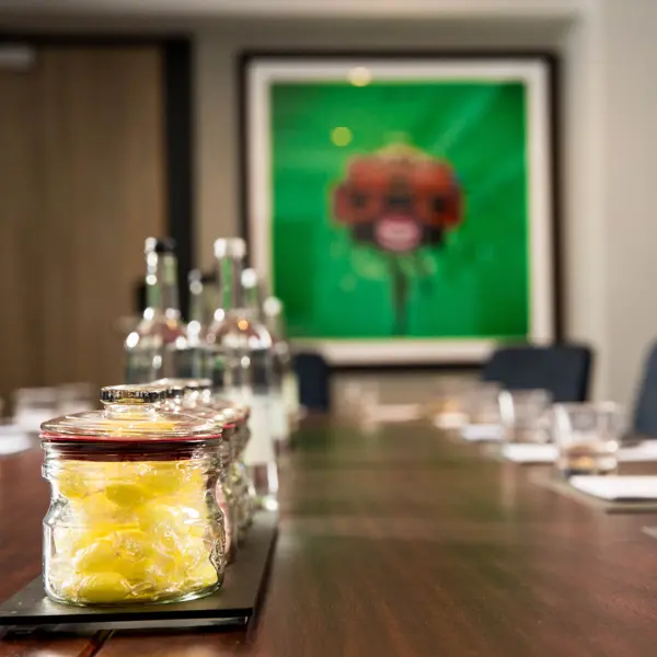 Close up of jars of boiled sweets on a wooden table