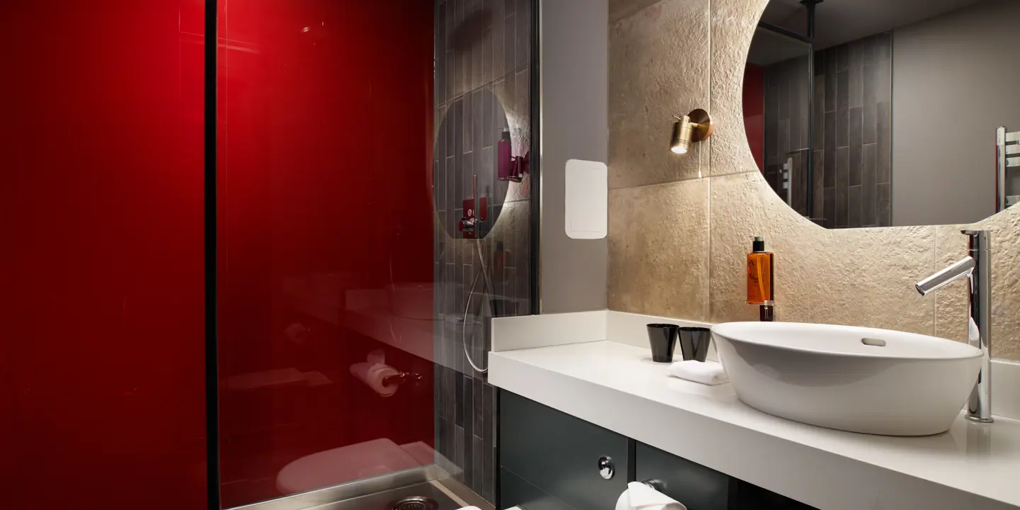 A bathroom featuring a sink, toilet, and shower.