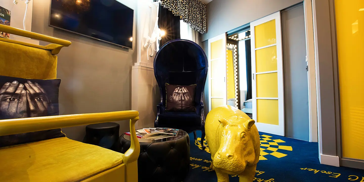 Living room featuring a fireplace and yellow furniture.