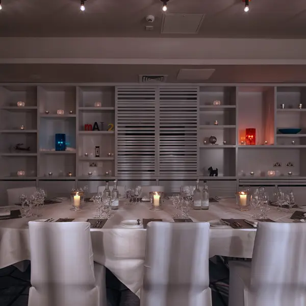 Dining room featuring a long table and chairs.