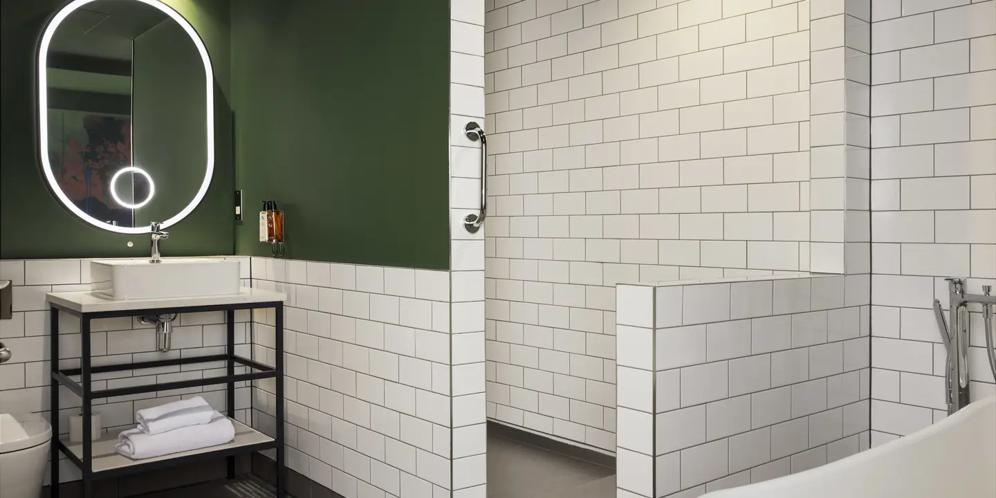 Bathroom with mirror, sink, walk-in shower and bathtub 