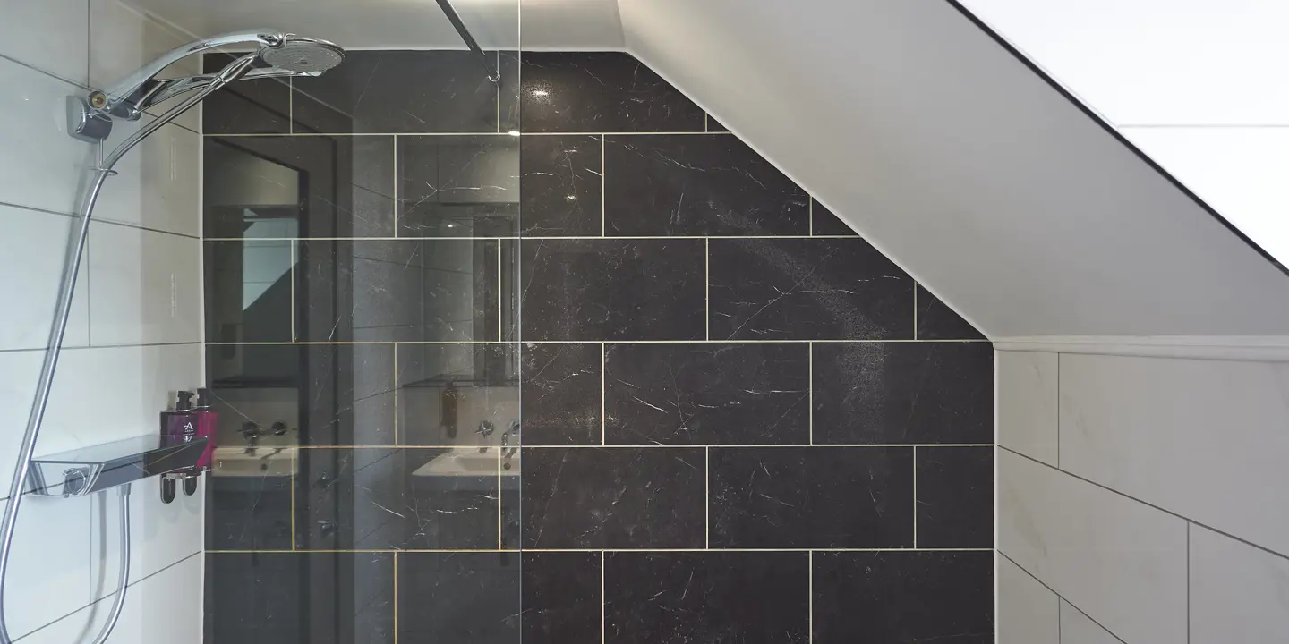 A bathroom featuring a shower.