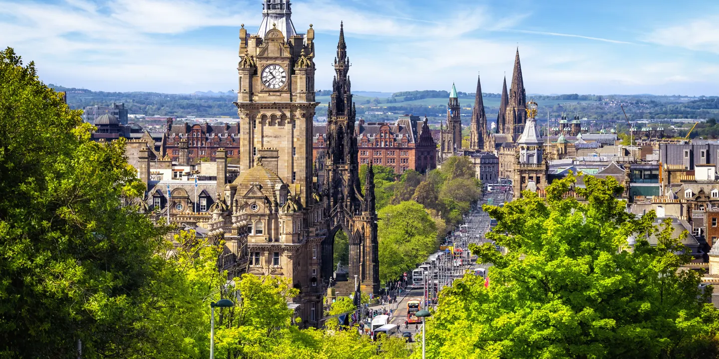 A towering clock tower overlooking a cityscape.