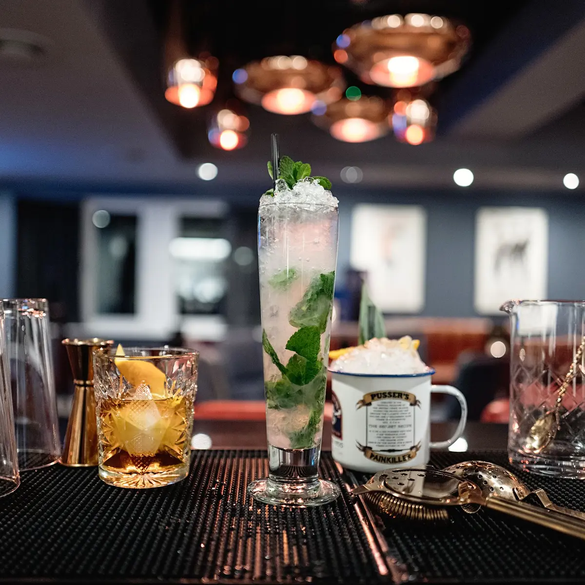 An assortment of various beverages displayed at a bar.