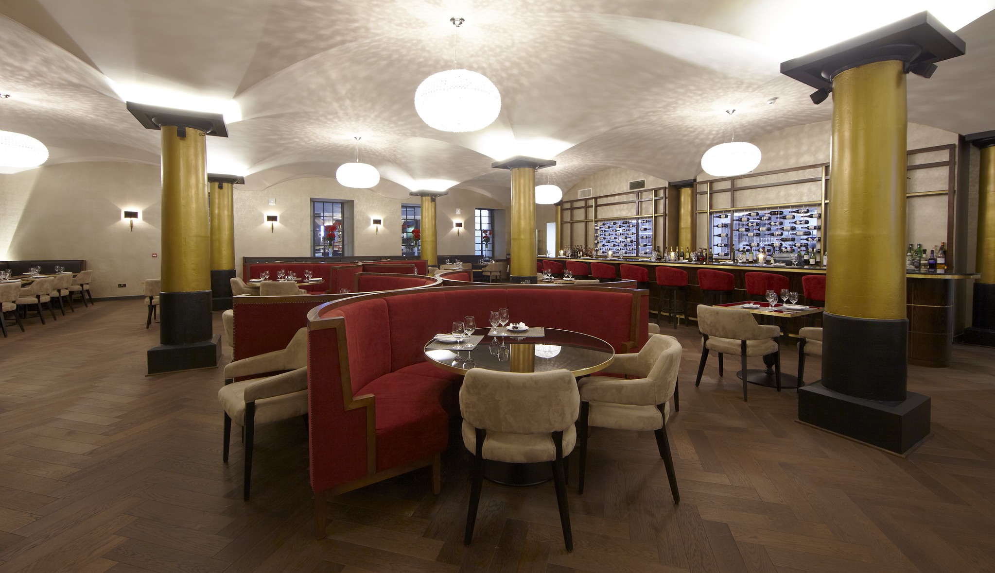 A restaurant featuring tables, chairs, and booths.