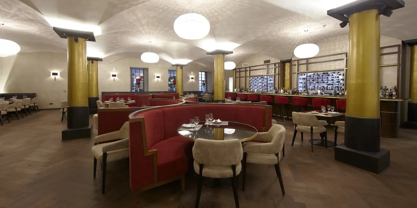 A restaurant featuring tables, chairs, and booths.