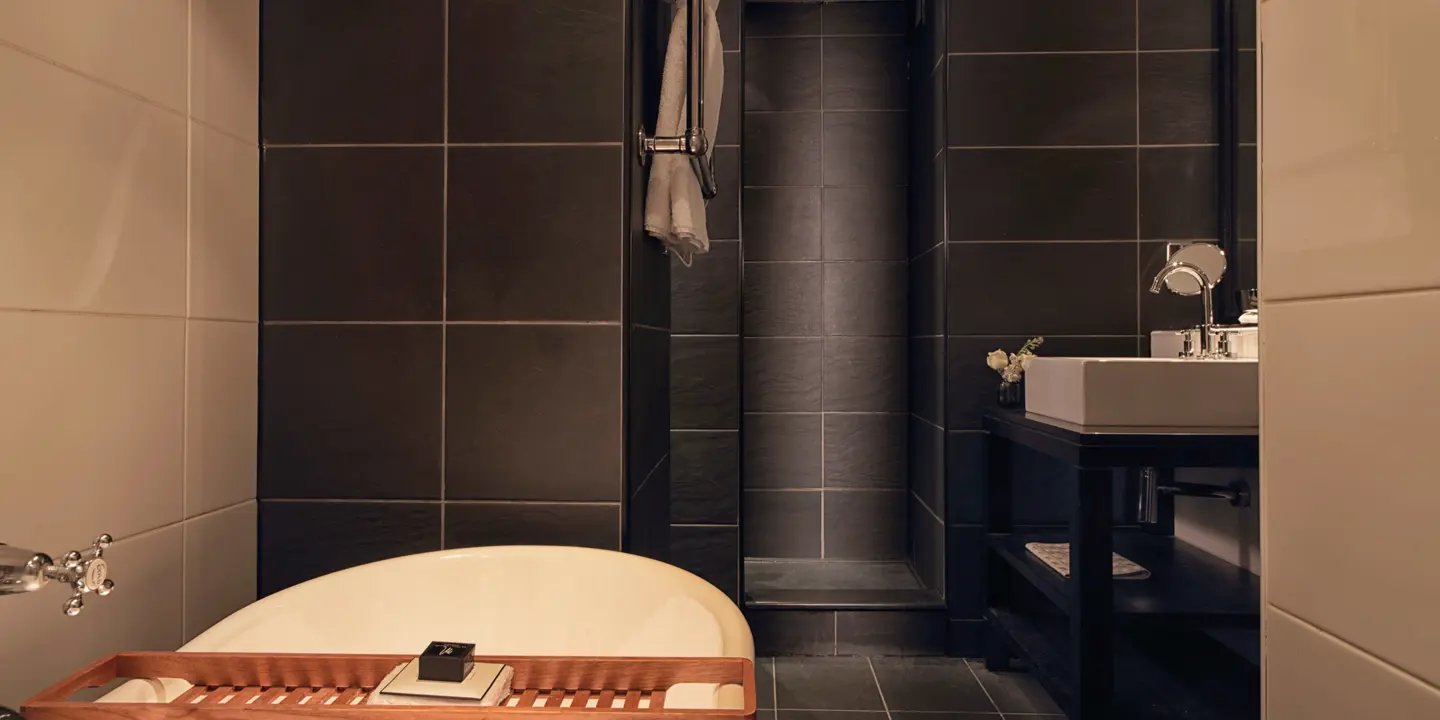 A bathroom featuring a bathtub and sink.