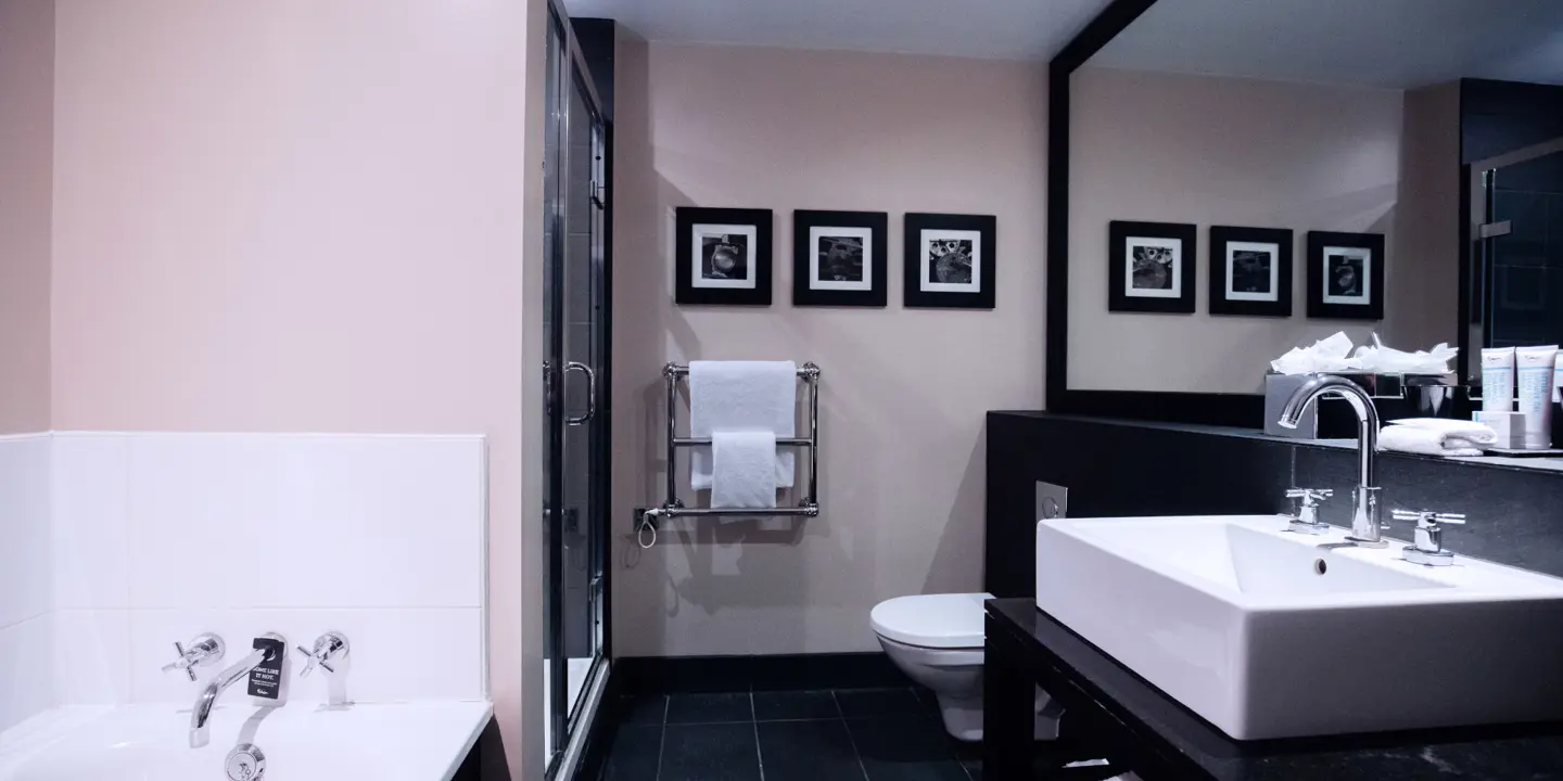 A bathroom featuring a sink, toilet, and bathtub.