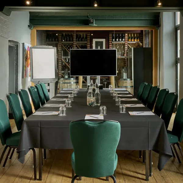 A table adorned with an assortment of wine bottles and elegant glasses.