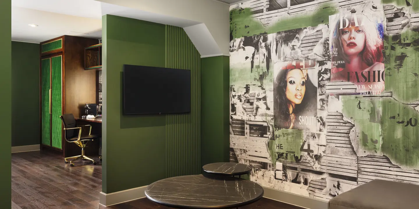 Spacious room with wall-mounted TV, coffee table and comfy sofa